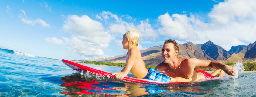 Father and Son Paddling on a Surfboard - Waikiki Beach